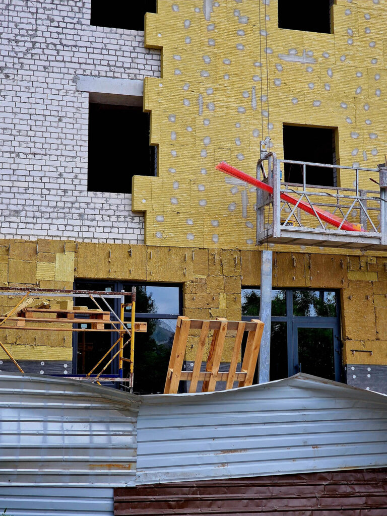 The,Facade,Of,An,Apartment,Building,Is,Insulated,With,Glass
