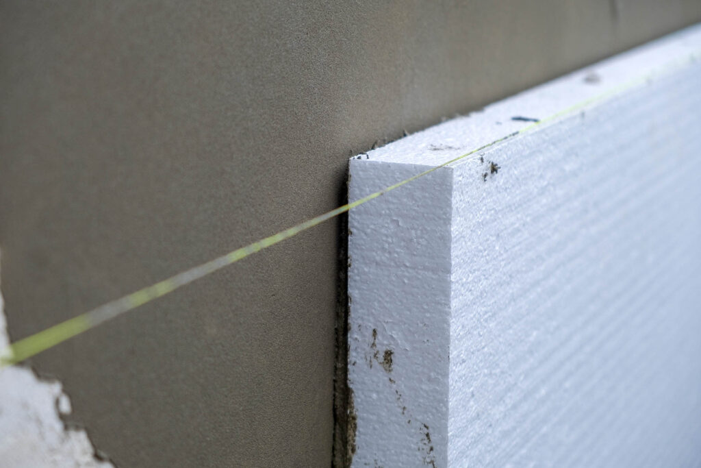 Installation,Of,Styrofoam,Insulation,Sheets,On,House,Facade,Wall,For